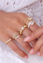 ANEL AJUSTÁVEL DOURADO COM DESIGN TORCIDO AN552-O