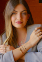 BRACELETE AJUSTÁVEL TREVO ÔNIX INOX DOURADO PM459-O