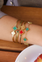 BRACELETE AJUSTÁVEL TREVO VERMELHO INOX DOURADO PM459-O