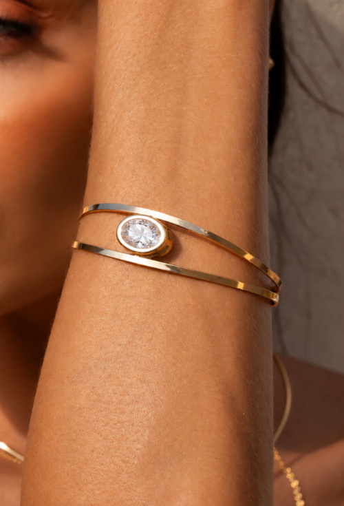 BRACELETE COM PEDRA OVAL CRISTAL BANHADO A OURO PM647-O