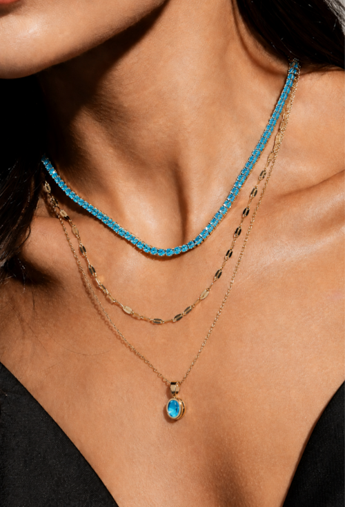 CONJUNTO OVAL COM PEDRA AZUL PARAÍBA BANHADO A OURO CJ215-O