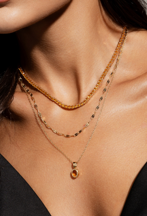 CONJUNTO OVAL COM PEDRA TOPÁZIO MARROM BANHADO A OURO CJ215-O