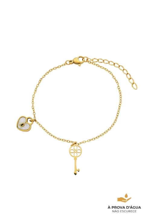 PULSEIRA COM CHAVE E CORAÇÃO PEROLADO AÇO DOURADO PM529-AD