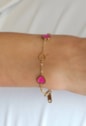PULSEIRA CORAÇÃO VAZADO PINK EM AÇO DOURADO PM566-AD