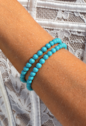 PULSEIRA DE PEDRAS LAPIDADAS REDONDAS TURQUESA BANHADA A OURO PM654-O