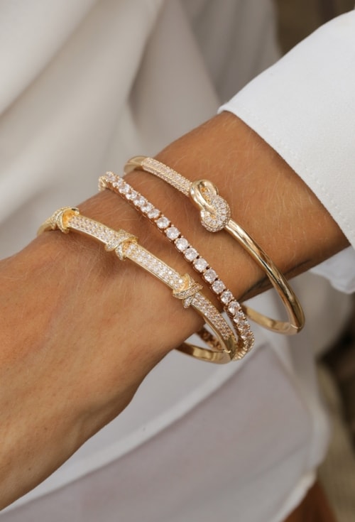 PULSEIRA RIVIERA CRISTAL BANHADO OURO PM600-O